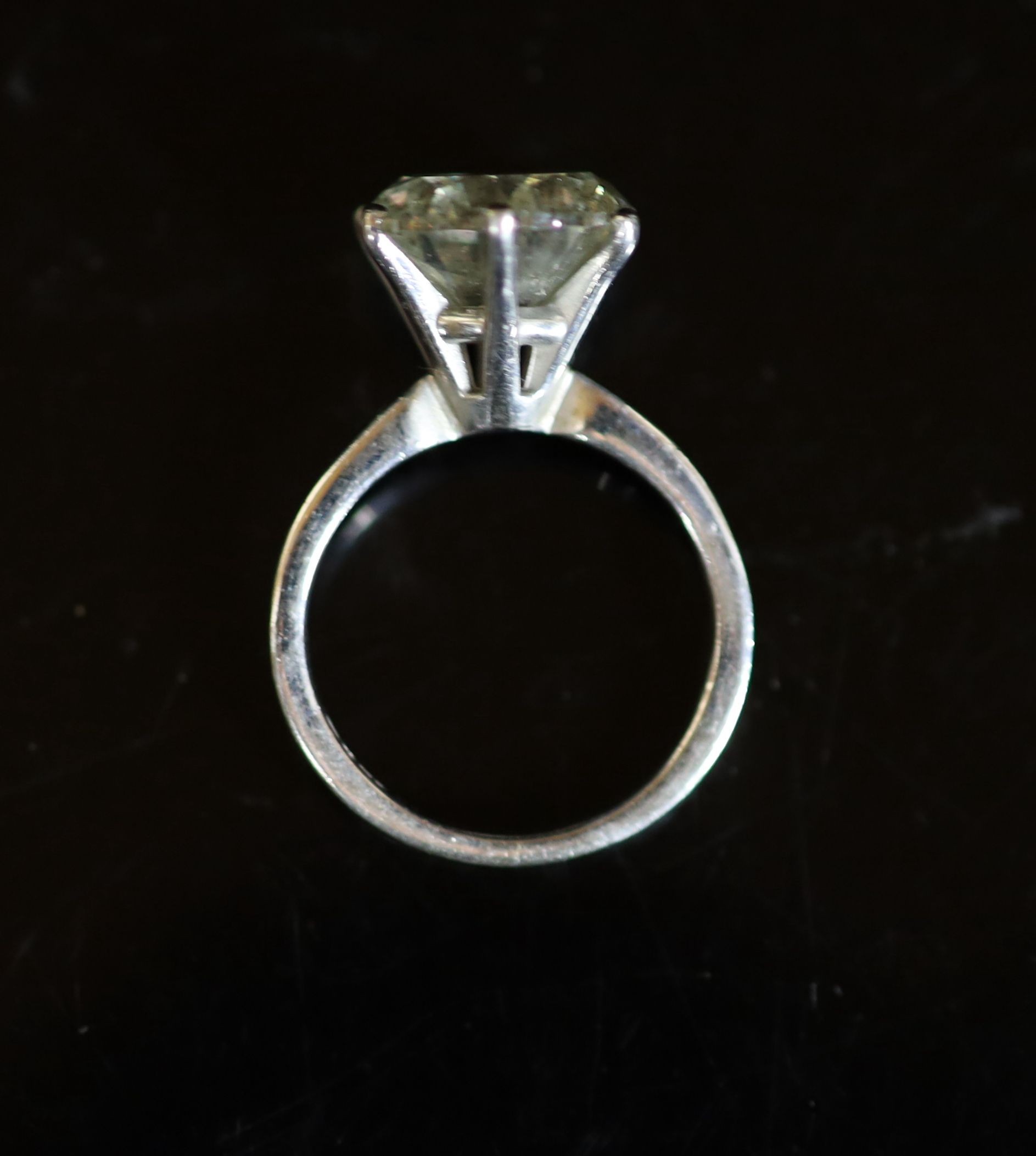 A modern 18ct white gold and solitaire diamond ring